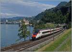 An SBB ETR 610 is traveling as EC 32 from Milano to Genève and runs along Lake Geneva near Villeneuve.