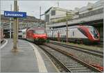 The SBB Re 460 045-8 with his IR 90 to Brig and a SBB RABe 502  Twindexx  to St Gallen in Lausanne.