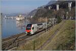 An SBB RABe 512, operating as RE 33 18413, is en route from Annemasse to St-Maurice and is seen shortly before Villeneuve at kilometer marker 28.155, with the Château de Chillon in the background.

January 1, 2026