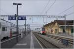 On the plattform 1 in Bex is arriving the RE 33 from Annemasse to St Maurice.