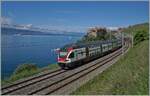 While the SBB RABe 511 020 is near Rivaz on the way towards Lusanne, the paddle wheel steamer  Vevey  can be seen on the lake in the background. 

May 28, 2024