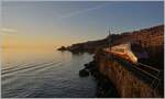 Sunset atmosphere between St Saphorin and Rivazs with the FS Trenitalia ETR 610 002, which is traveling from Domodossla to Genève as EC 30008.