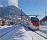 In strong backlight: An SBB RABe 501  Giruno  is on the way to Basel SBB as IC 21 10672 in Airolo. 

January 21, 2025