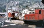 HGe 4/4 No 12 (ex BVZ) and Traktor Te 2/2 No 4926 (FO) at Brig, August 21st, 1979. In the background upon the bridge is a brown-coloured BLS Re 4/4 engine.