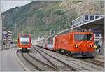 The MGB HGe 4/4 102 reaches the (MGB) train station of Brig with its Glacier Express.