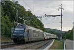 The BLS Re 465 002 wiht his RE on the way to Bern in Chambrelien.