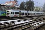 Kamlby advertising EMU 535 114 stands parked at Spiez on 1 January 2025, but will see action in less than ten minutes.