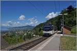 Picture with a view: While the CEV MVR ABeh 2/6 7503  Blonay-Chamby  reaches the Sonzier station as a regional train from Montreux to Les Avants, the view on the left glides far over the Riviera