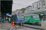 The two MOB advertising locomotives Ge 4/4 8001 and 8004 with their GoldenPass Express trains in Montreux.