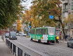 Tatra tram KT4SU No. 1107 (route 2) on Generala Chupkinky Street. Usually, trams in Lviv are painted yellow, but this one has an advertising tape on top. Taken on October 19, 2023.