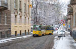 Modernized Tatra KT4SU tram No.1100 (route 4) on Ivan Kotliarevskyi Street. During the modernization, the tram received a front end similar to that of the latest generation of LAZ trolleybuses and buses. Taken on November 29, 2023.