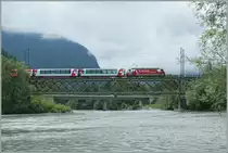 The  Glacier Express  coming from St Moritz on the way to Zermatt by Reichenau.
13.08.2010 