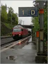 It's raining by the arriving on the SBB Re 460 015-1 with his IR in Vevey on the platform 1. 
19. April 2012