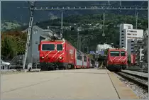MGB HGe 4/4 with Glacier Express an local Train du Zermatt in Brig. 
16.08.2014