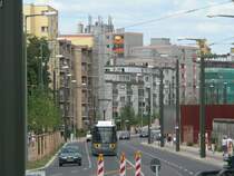 Tram in Berlin - in Background you see the  Mauergedenkst�tte  with a piece of the Berlin Wall. 2008