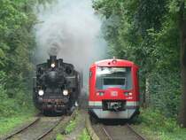 Old and new: prussian steam locomotive T11  7512 Hannover  with the Prussian Train and a class 474 train in Hoheneichen, 2007-09-02