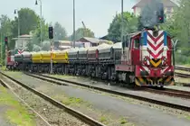 Strabag 740 858 banks a railway engineering train out of Rakovnik on 25 May 2015.