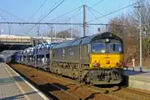 TrainSporT/RTB 653-05 hauls a train full with automotives through Antwerpen-Zuid on 23 March 2011.