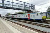 Opposing sunlight can be very nasty, especially with a light grey or white main colour, as NMBS 805 proves at Roosendaal on 28 June 2020.